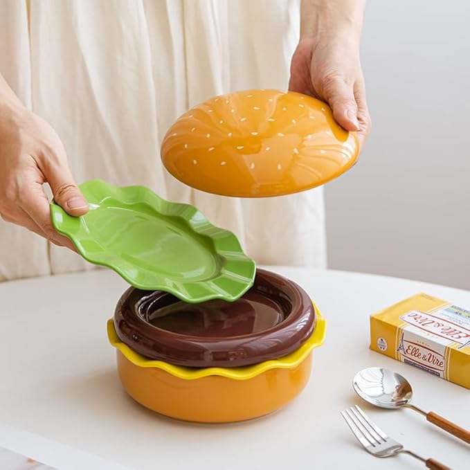 The Ceramic Hamburger Plates Collection is a creative 5-piece set of hamburger-shaped plates and bowls made of durable and elegant ceramic for a unique dining experience and fun.