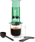 AeroPress Clear Green Coffee Press - All-in-One French Press Pour-Over &amp Espresso Style Manual Brewer 2 Min Brew for Less Bitterness More Flavor Small Portable Coffee Maker Travel &amp Campi