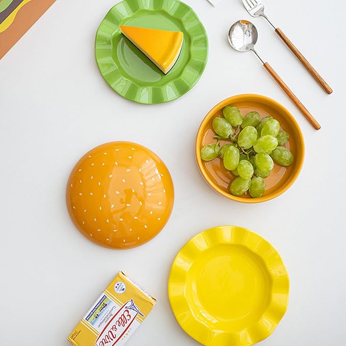 The Ceramic Hamburger Plates Collection is a creative 5-piece set of hamburger-shaped plates and bowls made of durable and elegant ceramic for a unique dining experience and fun.