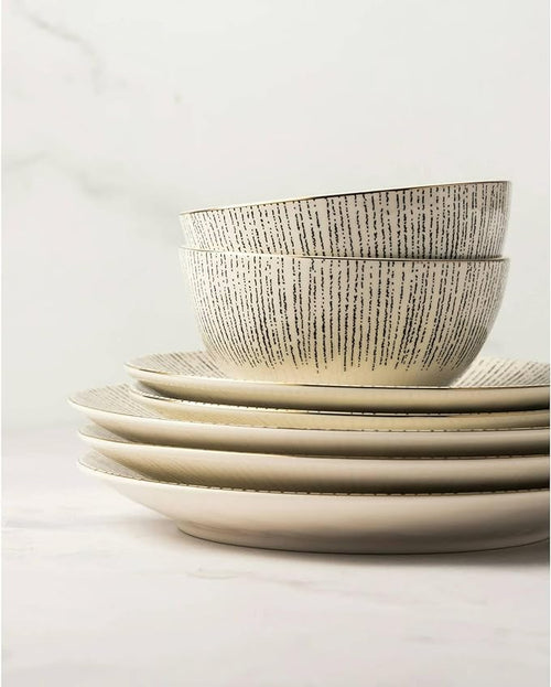 12-Piece Ceramic Dinnerware Set Plates and Bowls Service for 4 Microwave &amp Dishwasher Safe Complete Set: Includes 4 dinner plates 4 salad plates and 4 bowls Black/White