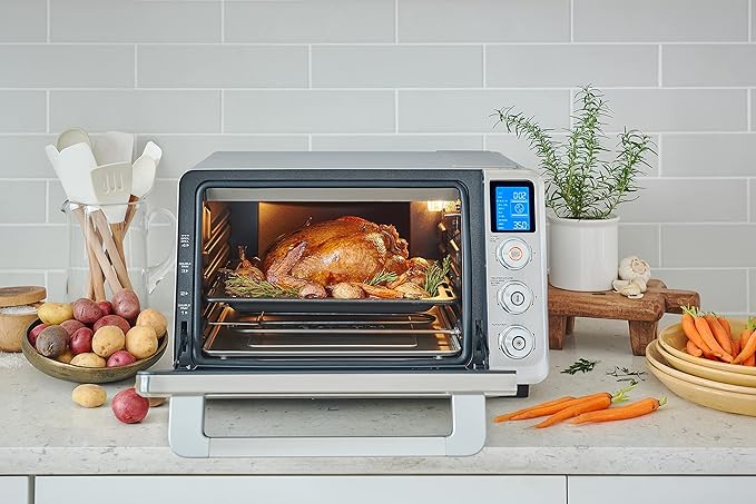 De'Longhi 10-in-1 Digital AirFryer 24L True Convection Toaster Oven with Internal Light Grills Broils Bakes Roasts Reheats Preset for Cookie &amp Pizza 1800-Watts Stainless Steel