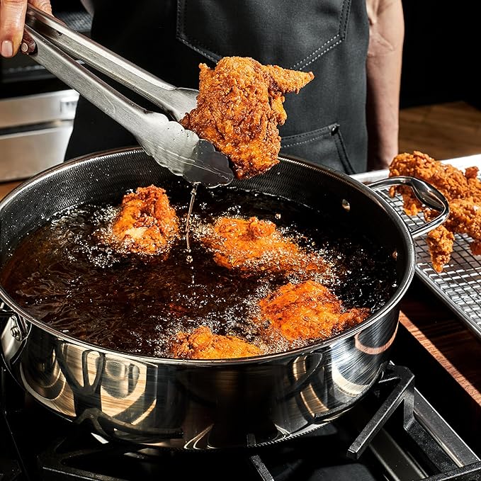 HexClad Hybrid Nonstick 4-Piece Cookware Set 7Qt Chicken Fryer with Lid and 12 Pan with Lid Stay-Cool Handles Dishwasher and Oven-Safe Induction Ready Compatible with All Cooktops