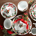 BrylaneHome 16 Piece Christmas Dinnerware Set (Service for 4) Includes Dinner &amp Salad or Dessert Plates Bowls Mugs Red &amp Green Holly &amp Holiday Ribbon Pattern - White